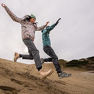 2 people running downhill